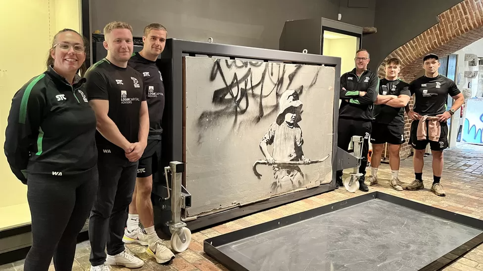 Bury St Edmunds Rugby Players Help Lift Banksy from Museum